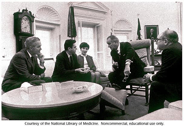 Marshall Nirenberg and his wife at the White House with President Lyndon B. Johnson, photograph, 1968?, DNA Learning Center, Cold Spring Harbor Laboratory (dnalc.chsl.edu)