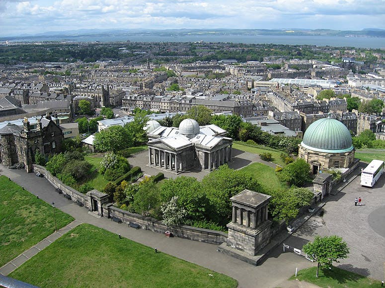 Calton Hill Observatory (now the Collective), Edinburgh; the old observatory where Thomas Henderson worked is at left; his memorial plaque is on the building at center (Wikimedia commons)