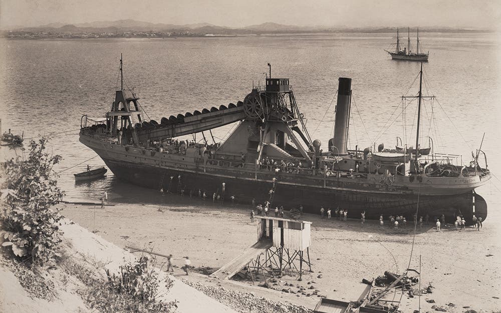 The 269 foot ladder dredge Corozal beached for repairs, June 1912.
Ladder dredges were used to remove material under water. The Corozal was designed to remove both soft soil and hard rock. It was used to excavate 4,000,000 cubic yards of rock and boulders at the Pacific entrance to the Canal. View in Digital Collection »