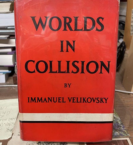 Dust jacket of Worlds in Collision, by Immanuel Velikovsky, Macmillan Co., 1st ed., 1950, a copy offered for sale by Chamblin Bookmine (chamblinbookmine.com)