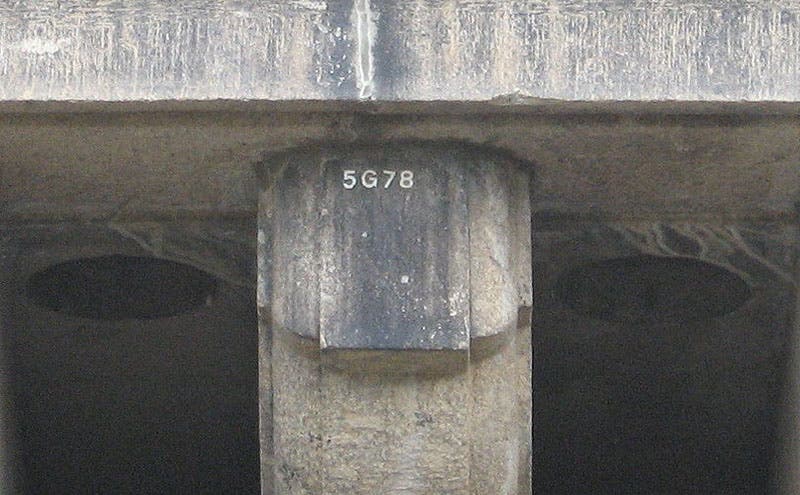 Detail of stonework on the New London Bridge, Lake Havasu City, Arizona, showing a stone ID number, used for reconstruction (Wikimedia commons)