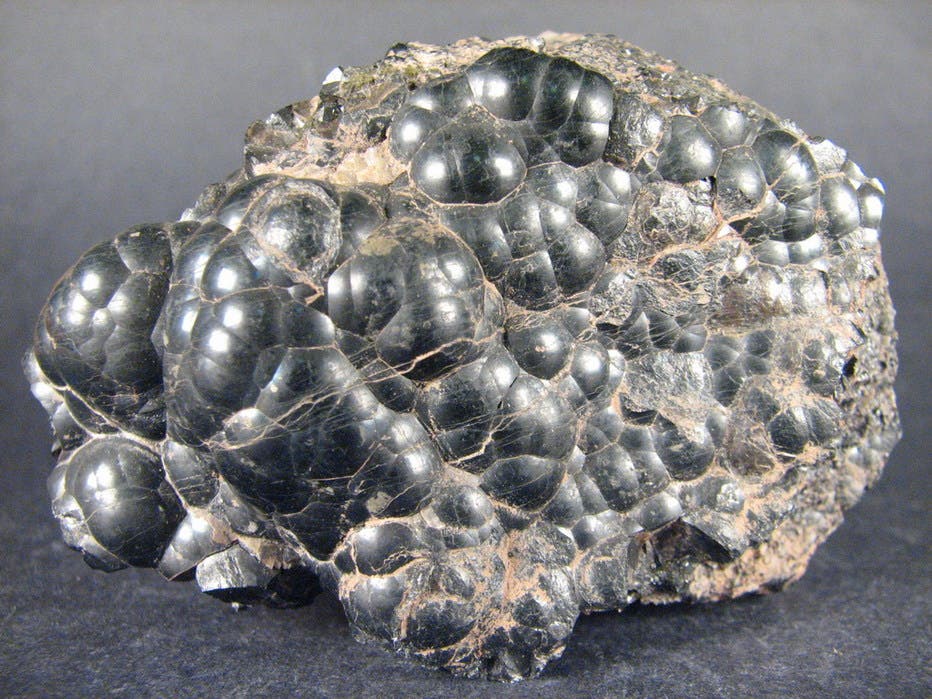Pitchblende ore, such as that used by the Curies and Debierne in their search for new radioactive elements (mindat.org)