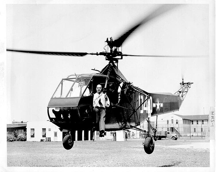 An R-4 Sikorsky helicopter posing for a publicity photo, with Sikorsky aboard, 1944. He wears no fedora, perhaps because on this occasion he was not the pilot (Wikimedia commons)