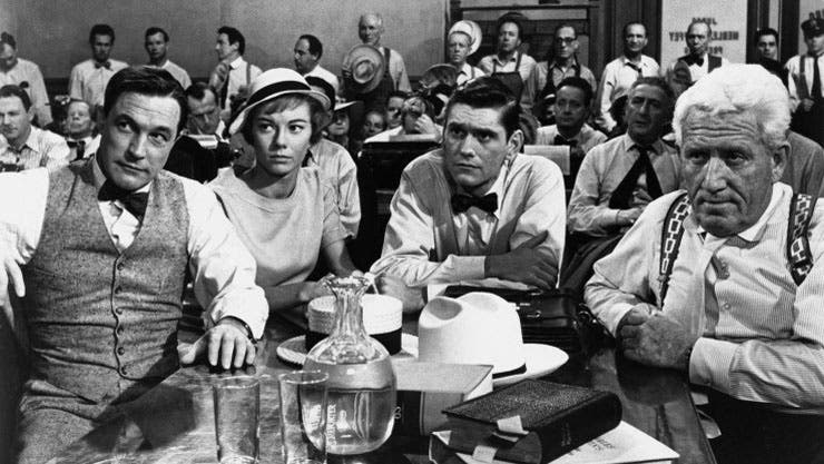 Cinematic still from Inherit the Wind, with Gene Kelley as H.L. Mencken and Spencer Tracy as Clarence Darrow.