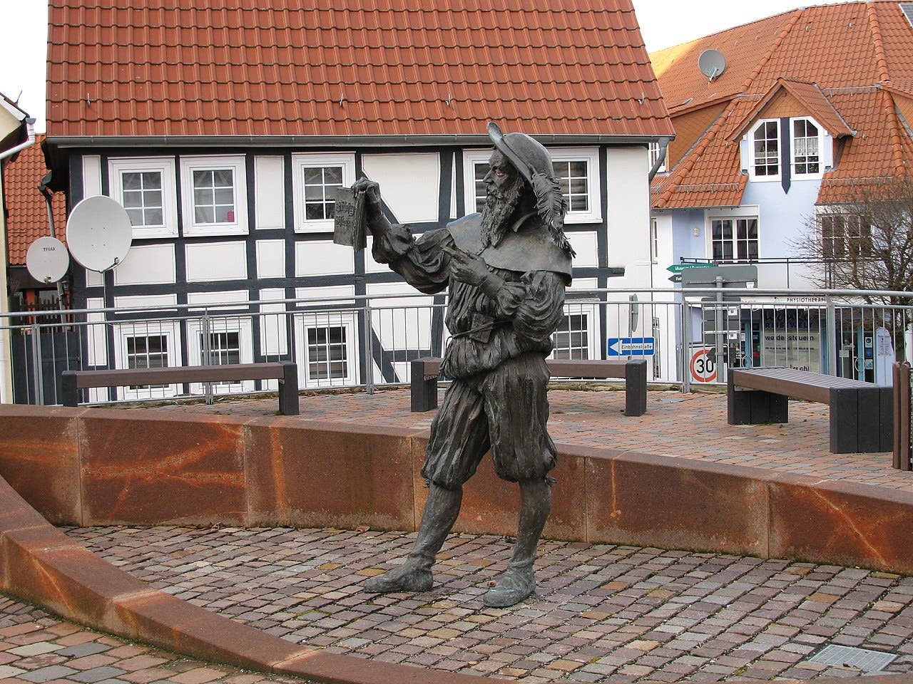 Statue of Hans Staden, holding a copy of his book, Warhaftige Historia und Beschreibung (1557), bronze, Wolfhagen, Hesse (Wikimedia commons)