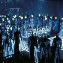The “Strangers” in the underworld, standing around a model of the City above, a movie still from Dark City (1998), Internet Movie Database (imdb.com)