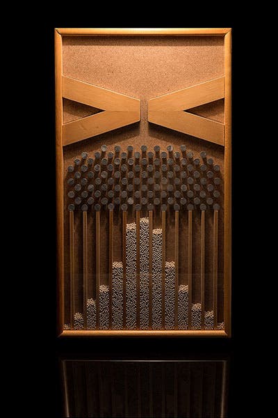 A modern Galton board or box, which can be flipped to generate a normal distribution of falling balls (Wikimedia commons)