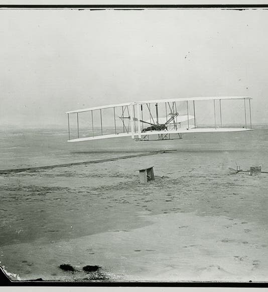 The first flight of Flyer at Kitty Hawk, Dec. 17, 1903, with Orville on the wing and Wilbur on the ground, National Air and Space Museum, Smithsonian Institution (airandspacd.si.edu)
