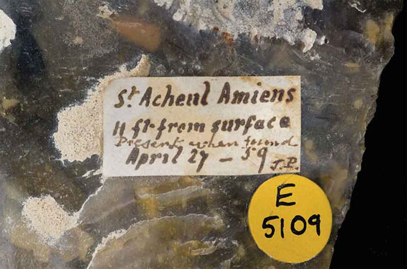 The label on a hand-axe from Saint-Acheul, Amiens: “St. Acheul Amiens/ 11 ft. from surface/ [entered later] present when found/ April 27 – 59 / J.P.”; Natural History Museum, London (nhm.ac.uk)