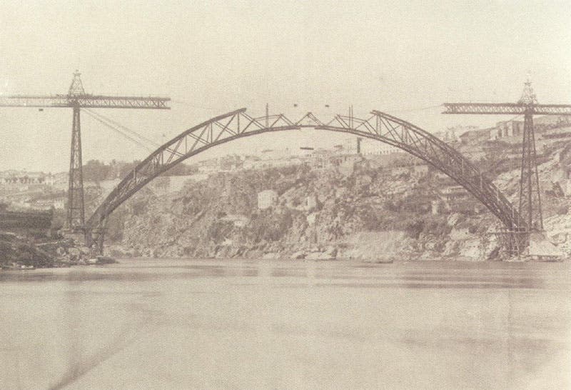 The Maria Pia Bridge under construction, over the River Douro near Porto, Portugal, built by Gustave Eiffel’s company, 1877 (Wikimedia commons)
