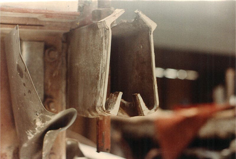 One of the box-beams from the collapsed fourth-floor walkway, showing how the nut on the end of a rod has deformed and pulled through the beam, photograph, 1981 (structuremag.org)