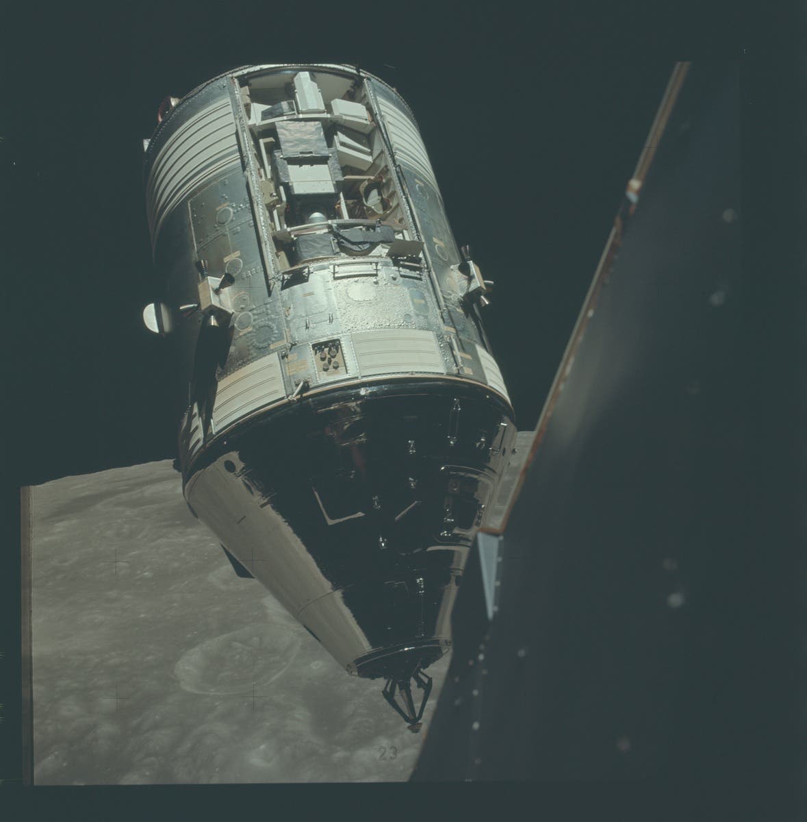 Photograph of the Apollo 17 Command Module, America, that gives a clear view of the SIM bay. The picture was taken by astronauts in the Lunar Module, Challenger, after their stay on the surface. Image source: NASA photograph AS17-145-22254.