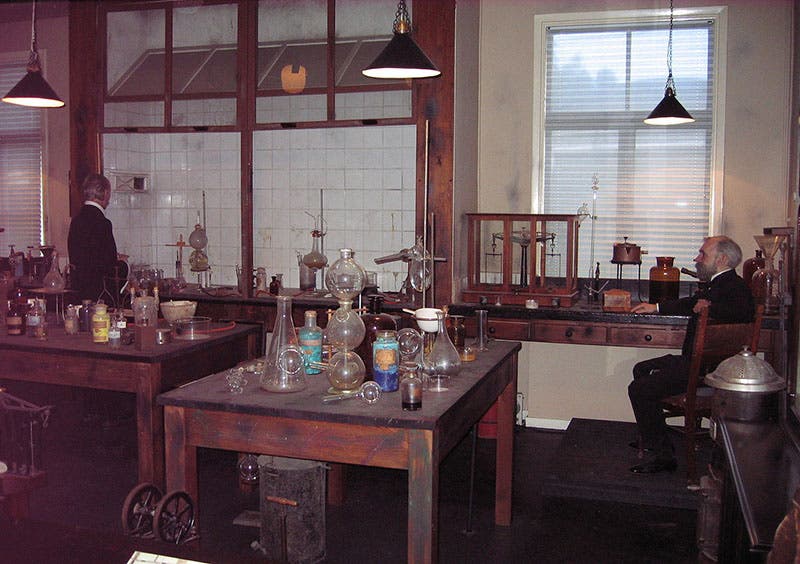 Re-creation of Alfred Nobel’s laboratory, Nobel Museum at Björkborn, Karlskoga, Sweden; that is a wax figure of Nobel himself at right rear (Wikimedia commons)