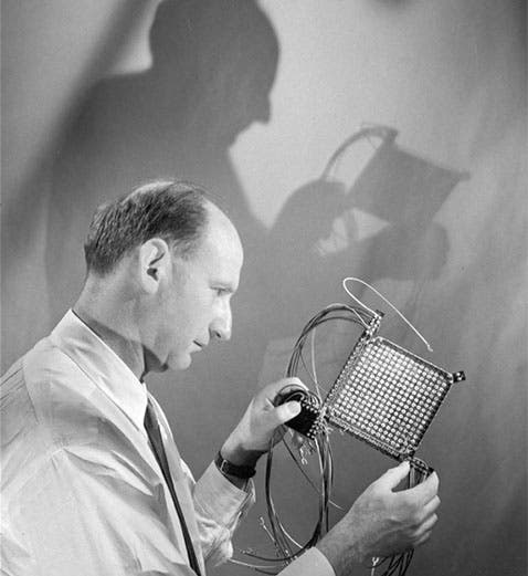 Jan Rajchman holding a 256-bit magnetic core memory array, which he assembled at RCA’s Princeton laboratories in the early 1950s. (David Sarnoff Library Collection, Hagley Museum and Library)