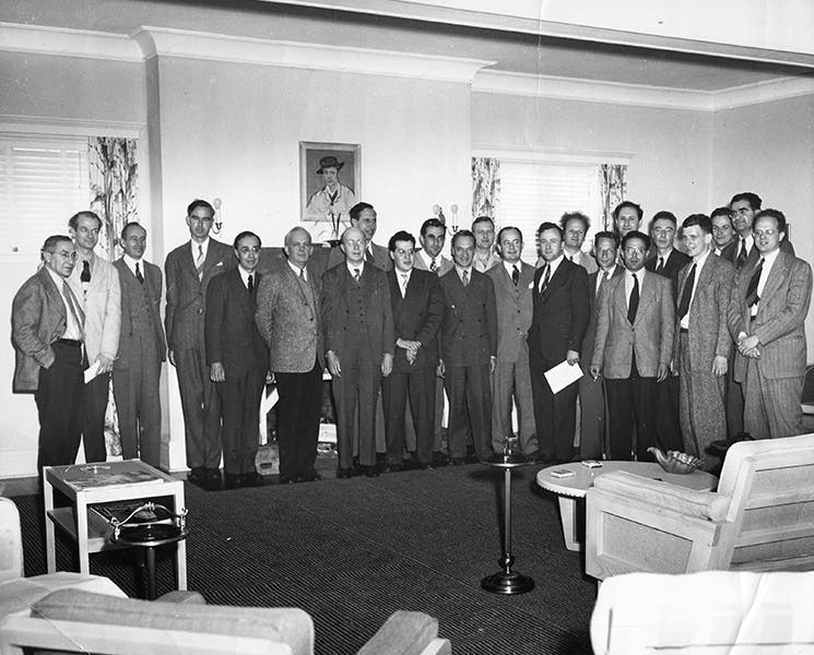 Group photo of participants at the Shelter Island Conference, June 2-4, 1947; Schwinger is at the center of the front row, with clutched hands; Feynman is third from the right in the back; Oppenheimer is fifth from right; Bethe with frizzled hair is ninth from the right in front of the window, just behind John Wheeler; photograph property of the Julian Schwinger Foundation (schwingerfoundation.org)