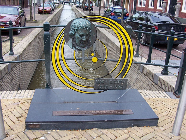 Bronze relief portrait of Eise Eisinga, with a representation of his Planetarium, on a bridge over a canal, somewhere in Friesland (Wikimedia commons)