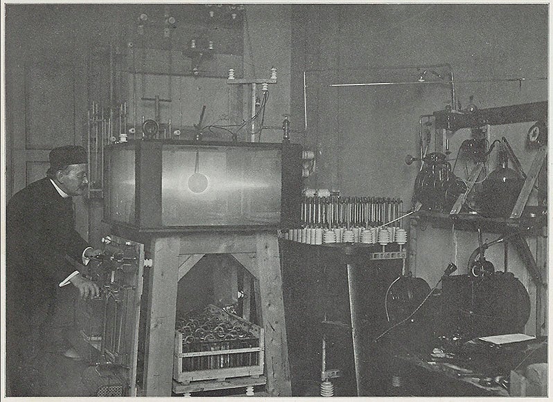 Kristian Birkeland with his terrella and its vacuum chamber in his lab in Kristiania (now Oslo), photograph, from his Norwegian Aurora Polaris Expedition, 1902-03, 1908-13 (Linda Hall Library)
