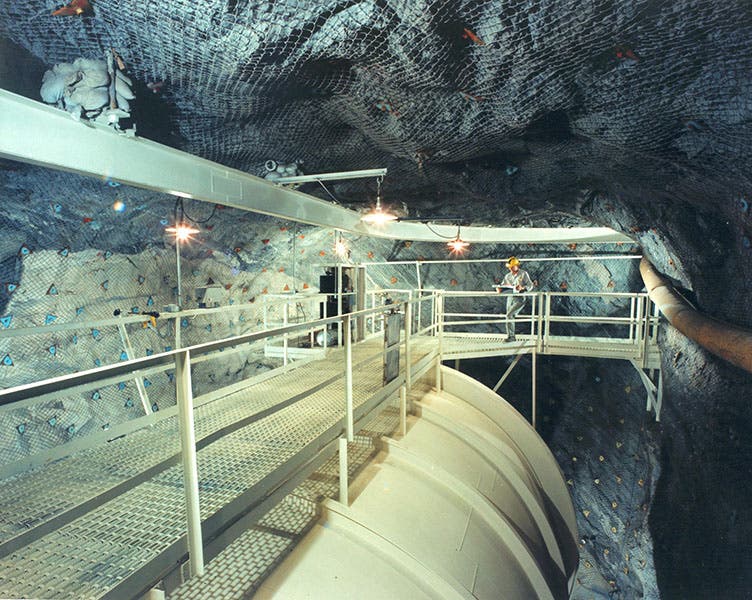 Tetrachloroethylene tank in the Homestake Mine, photograph, 1970s?, with Raymond Davis Jr. at the far end (U.S. Department of Energy on flickr.com)
