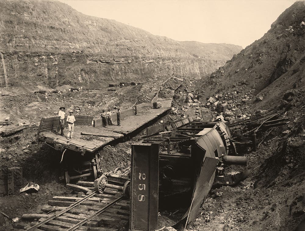 Steam shovel #258 and loaded flat cars caught in a slide at Culebra, May 29, 1913.
From 1907 through 1914, the Canal experienced over 100 slides. Some came without warning, burying workers and equipment and completely blocking the Canal. View in Digital Collection »
