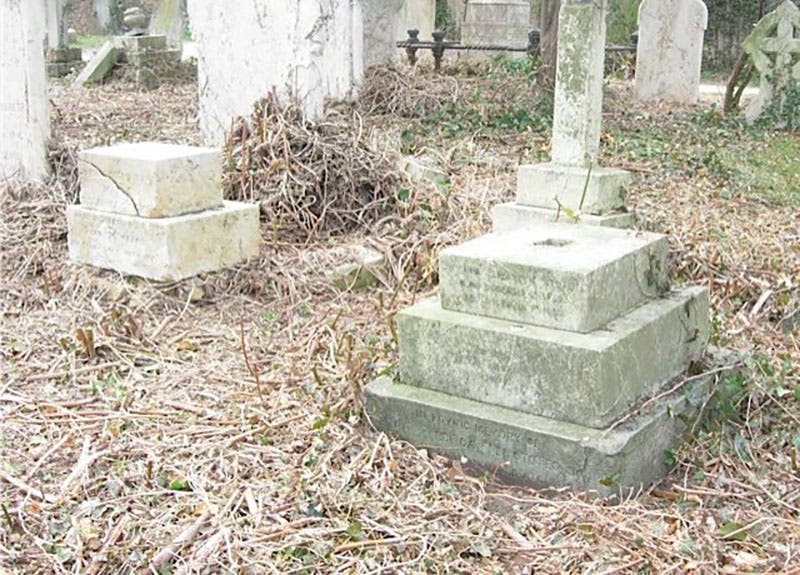 Grave for George Stokes, his wife Mary, and two infant children; Mary’s stone is at left, the infants’ at right; George’s grave between them is unmarked (millroadcemetery.org.uk)
