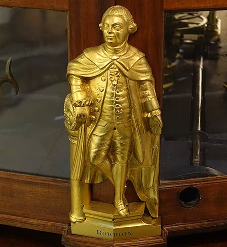 Statuette of James Bowdoin II, brass, possibly by Paul Revere, before 1787, one of four that adorn the base of the Joseph Pope orrery, Putnam Gallery, Harvard University (Wikimedia commons)