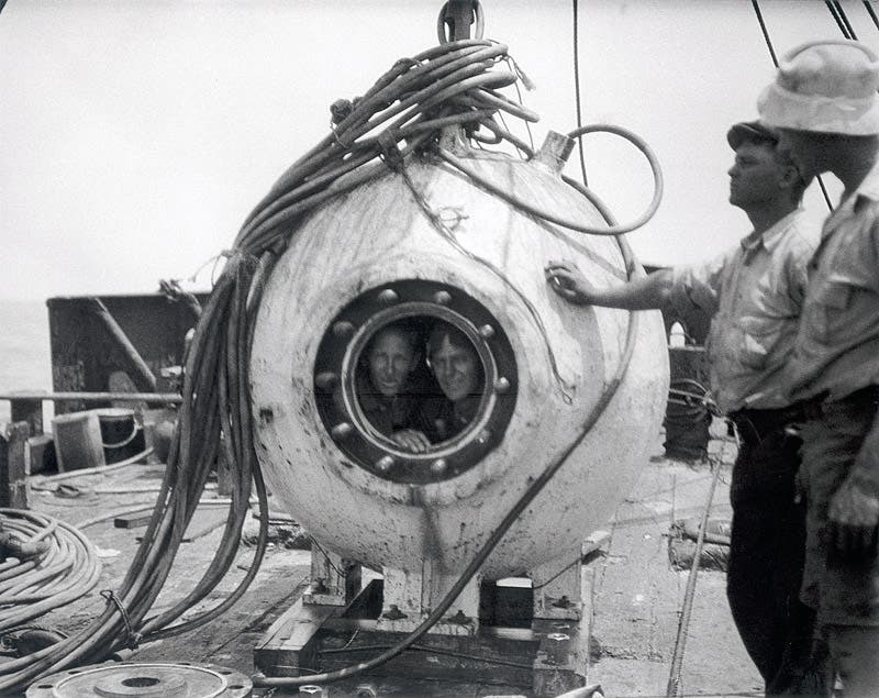 Otis Barton (right) and William Beebe peering out of the quartz window of the hatch of the Bathysphere, 1934? (Philbrick Crouch at clarksvilleonline.com)