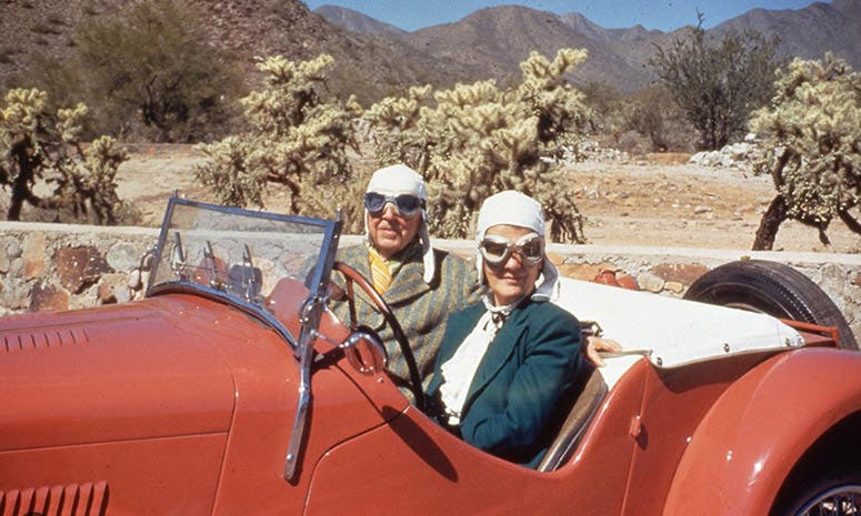 Frank Lloyd Wright and his last wife, Olgivanna, in their special color roadster, on the grounds of his Arizona estate, Taliesin West, photograph, undated, Frank Lloyd Wright Foundation (fllwfoundaton on facebook.com)