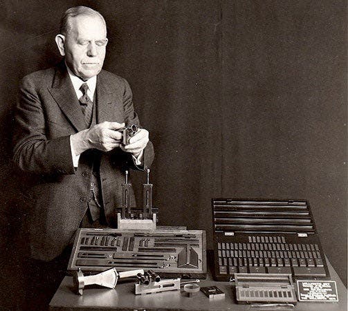 An older Carl Johansson and several sets of his gauge blocks, undated photograph, 1920s? (greatgages.com)