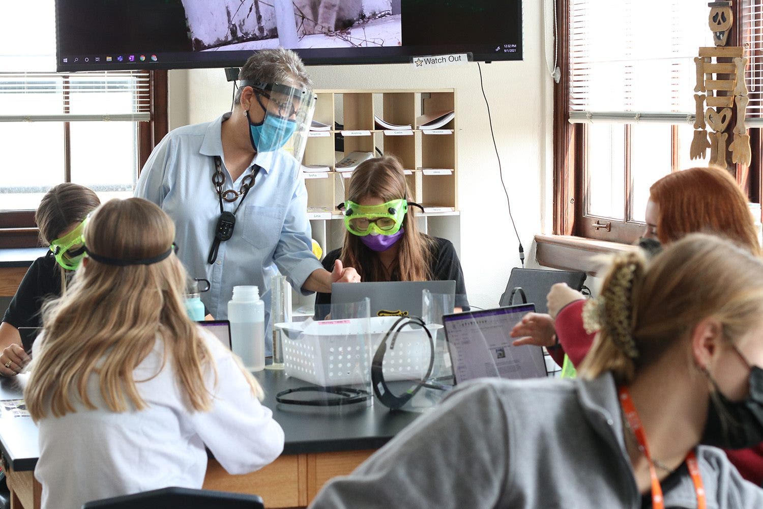 Kids and Teacher with goggles and computers