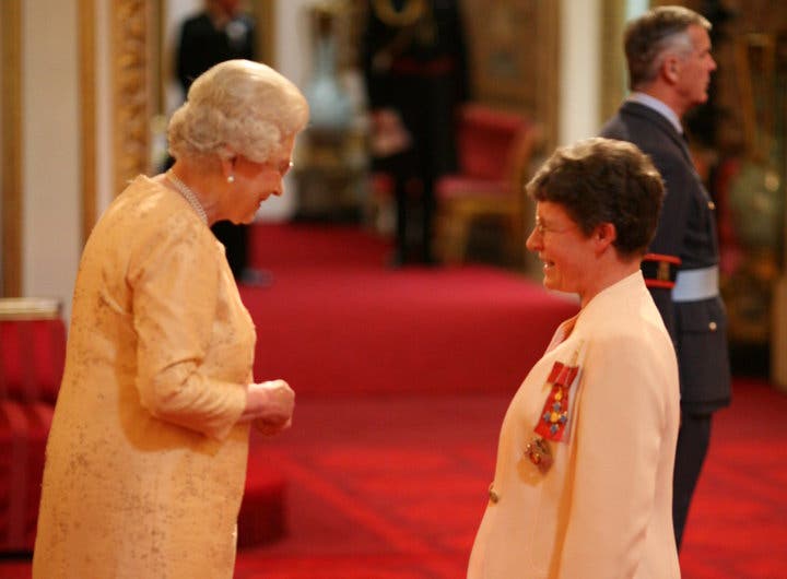 Queen Elizabeth II anointing Jocelyn Bell Burnell a Dame Commander of the British Empire, 2007 (anneofcarversville.com)