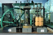 A restored Woolf compound beam engine, built by a German firm in 1858, and on display at an unknown location in Germany (Wikimedia commons)