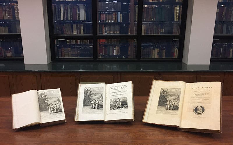 The editions of Euclid (left), Apollonius (center), and Archimedes, with their frontispieces, on display in the reading room, outside the glass vault (Linda Hall Library)