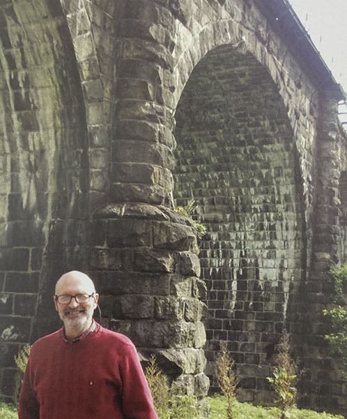 Photograph of Eric DeLony standing by the Thomas Viaduct, built in 1835 in Elkridge, Maryland, in a book dedicated to DeLony, Covered Bridges and the Birth of American Engineering, ed. by Justine Christianson and Christopher Marston, HAER, 2015; photo by Christopher Marston, 2012 (Linda Hall Library)