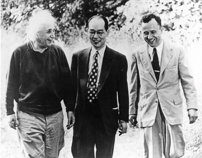Albert Einstein, Hideki Yukawa, and John Wheeler (left to right), walking on the grounds of the Institute for Advanced Studies, Princeton, photograph, 1954, Emilio Segrè Visual Archives, American Institute of Physics (scientificamerican.com)