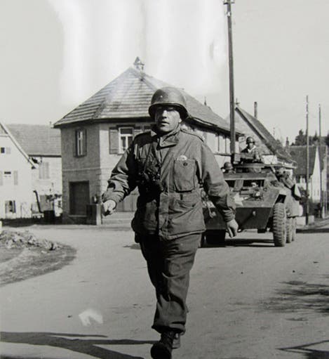 Colonel Boris Pash striding into an unidentified liberated city, undated photograph, ca 1944 (historycollection.com)
