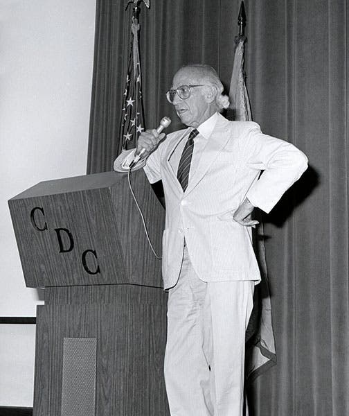 Jonas Salk addressing the Center for Disease Control, photograph, 1988 (Wikimedia commons)