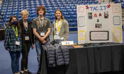 Peggy Kelly with students at the Kansas City Invention Convention
