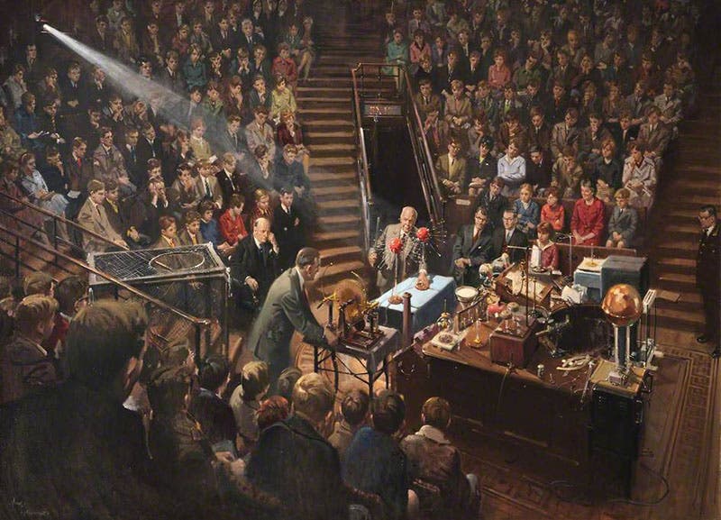 Sir Lawrence Bragg Giving the 1961 Christmas Lectures in the Royal Institution Theatre, oil on canvas, by Terence Cuneo, 1962, The Royal Institution. Bill Coates, one of the Institution’s technicians, can be seen operating a Wimshurst machine. (artuk.org)
