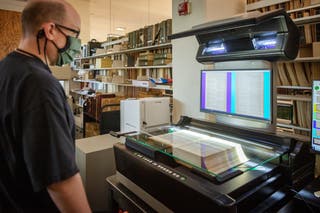 Linda Hall Library digital technician scanning book