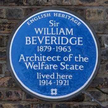 Blue plaque on a house in London, honoring William Beveridge, making no mention of his role in founding the Academic Assistance Council in 1933 (english-heritage.org.uk)