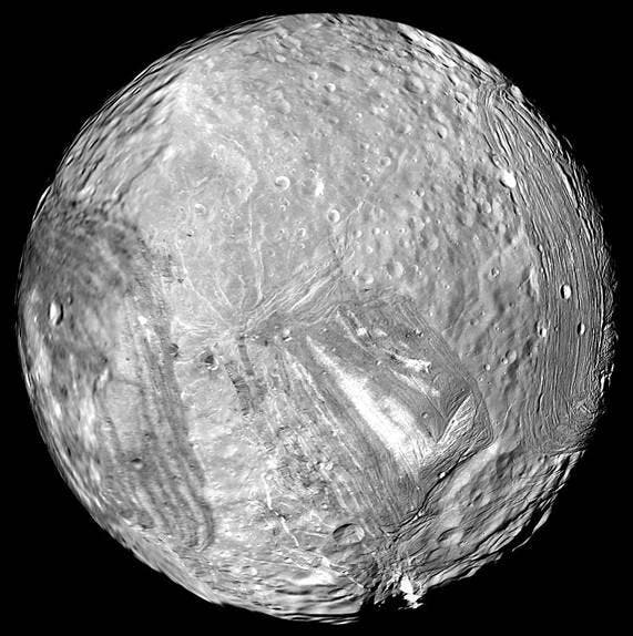 Miranda, fifth moon of Uranus to be discovered, by Gerard Kuiper in 1948, photograph by the Voyager 2 spacecraft, 1986 (NASA via Wikimedia commons)