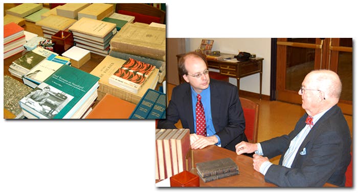 Associate VP for Collections Ben Gross (L) disusses the book collection with Stewart Gillmor
