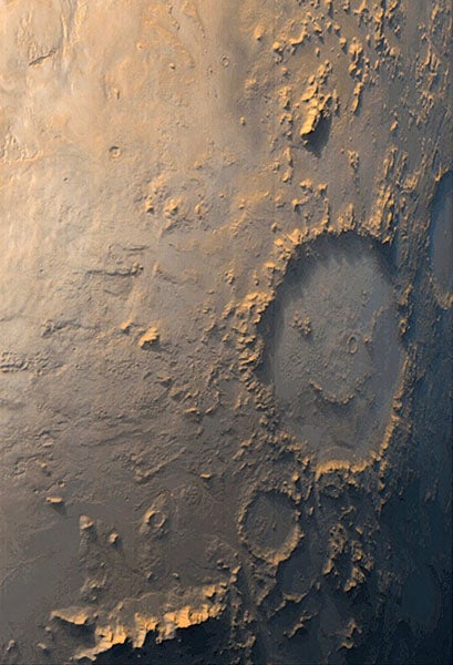 Galle crater on Mars, also known as the “Happy-Face” crater, photographed by the orbiting Mars Global Surveyor, 1999 (Wikimedia commons)