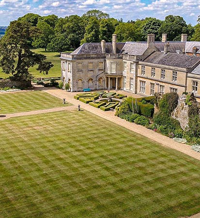 The manor house of Lamport Hall, with Charles Isham’s rockery at right center, recent photograph (discover-northamptonshire.co.uk)