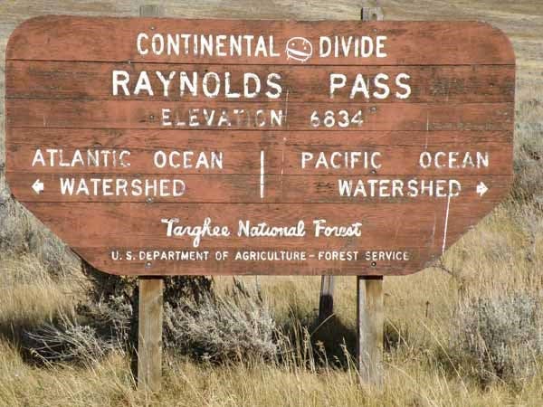 Sign denoting “Raynolds Pass,” connecting Montana and Idaho just of Yellowstone Park, recent photograph (waymarking.com)