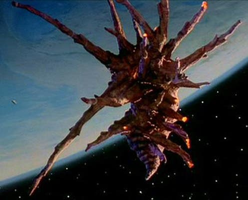 Space ship of the Black Lectroids, in orbit around the Earth and monitoring the activity of the Red Lectroids and Buckaroo Banzai (henryherz.wordpress.com)