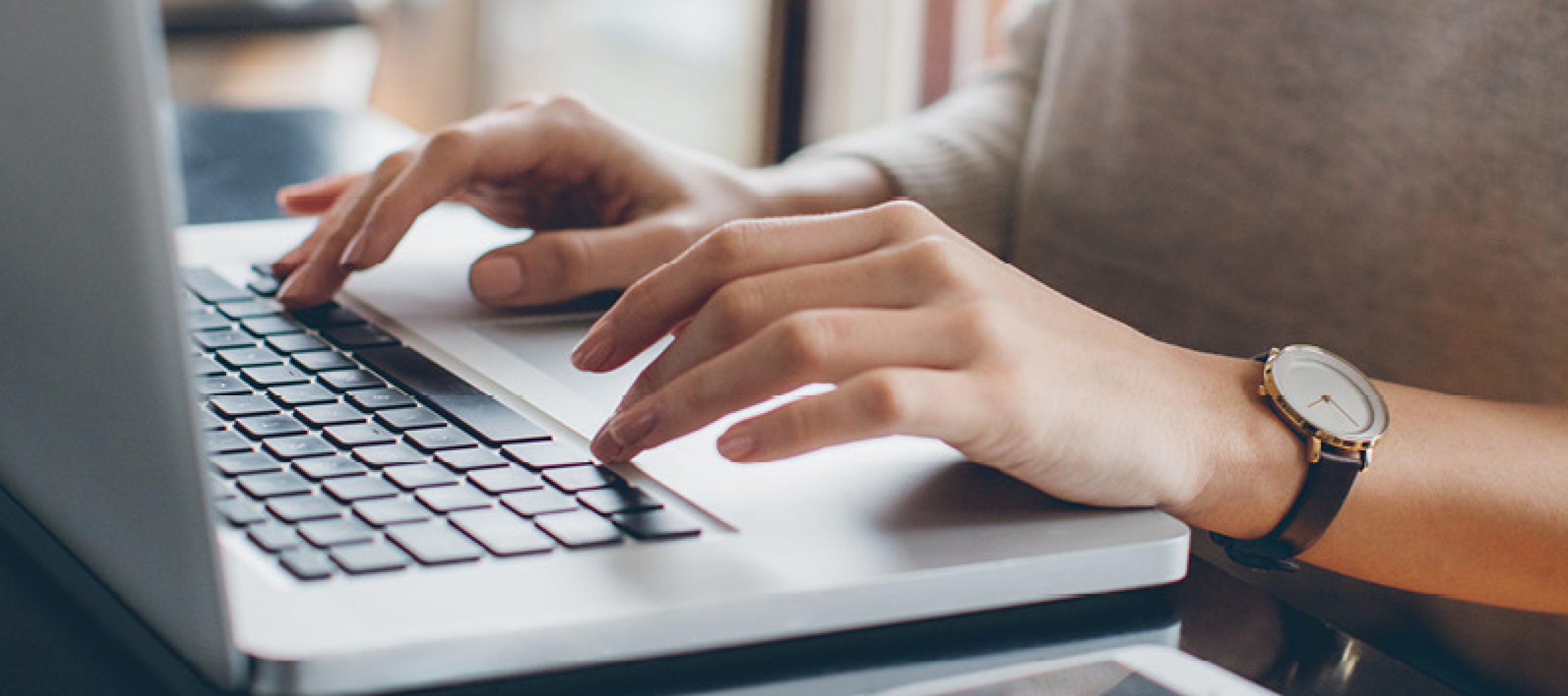 Female typing on a laptop