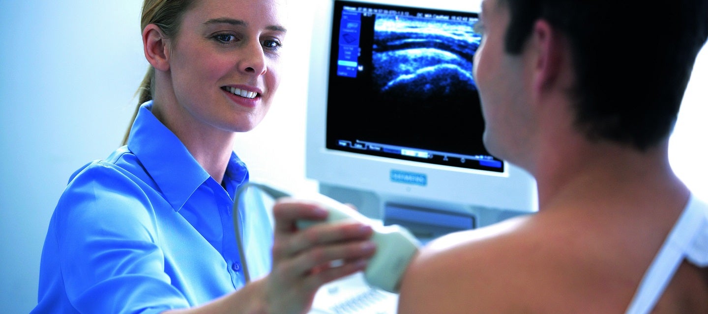 Patient getting an ultrasound of the shoulder