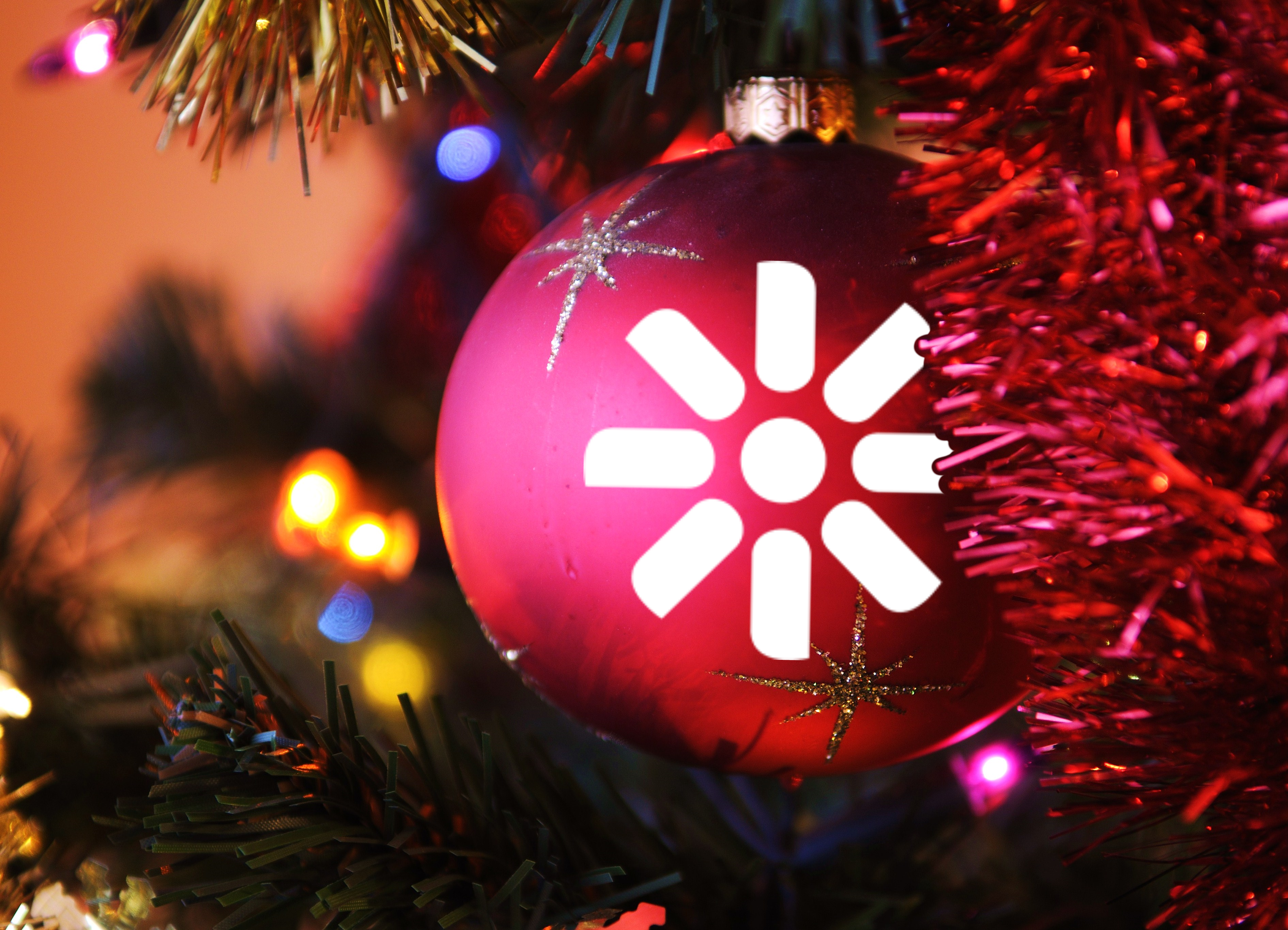 Kentico Christmas bauble hanging on a tree