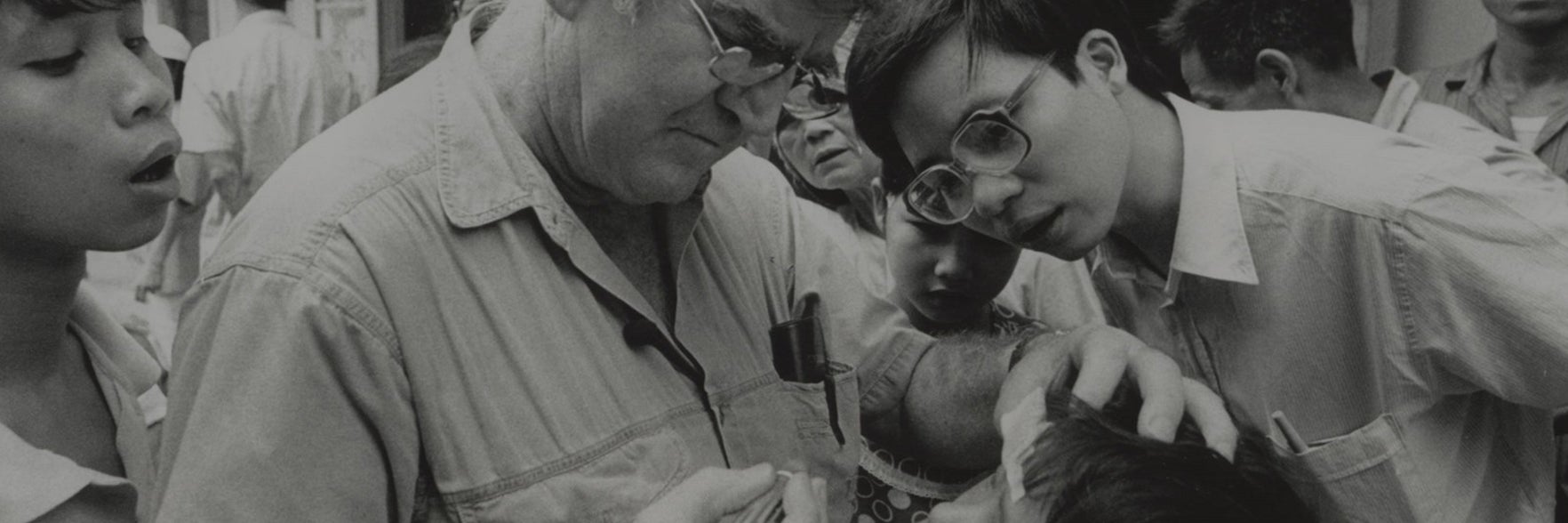 Fred Hollows examining a persons eyes
